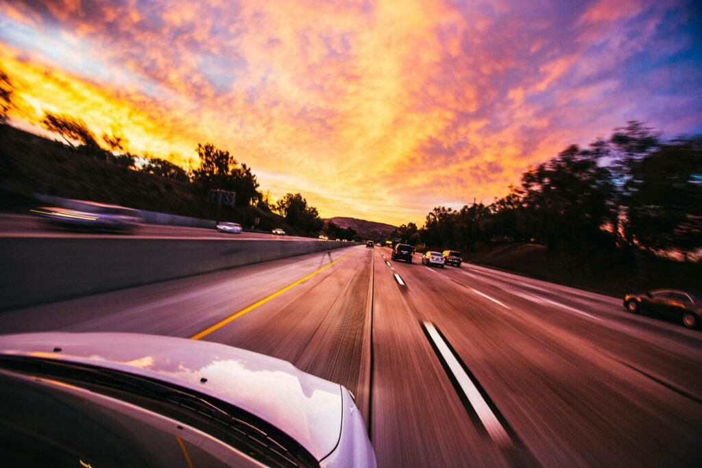 pexels-photo-593172-593172 Motion blur of cars speeding on an Irvine highway at sunset with vibrant skies.